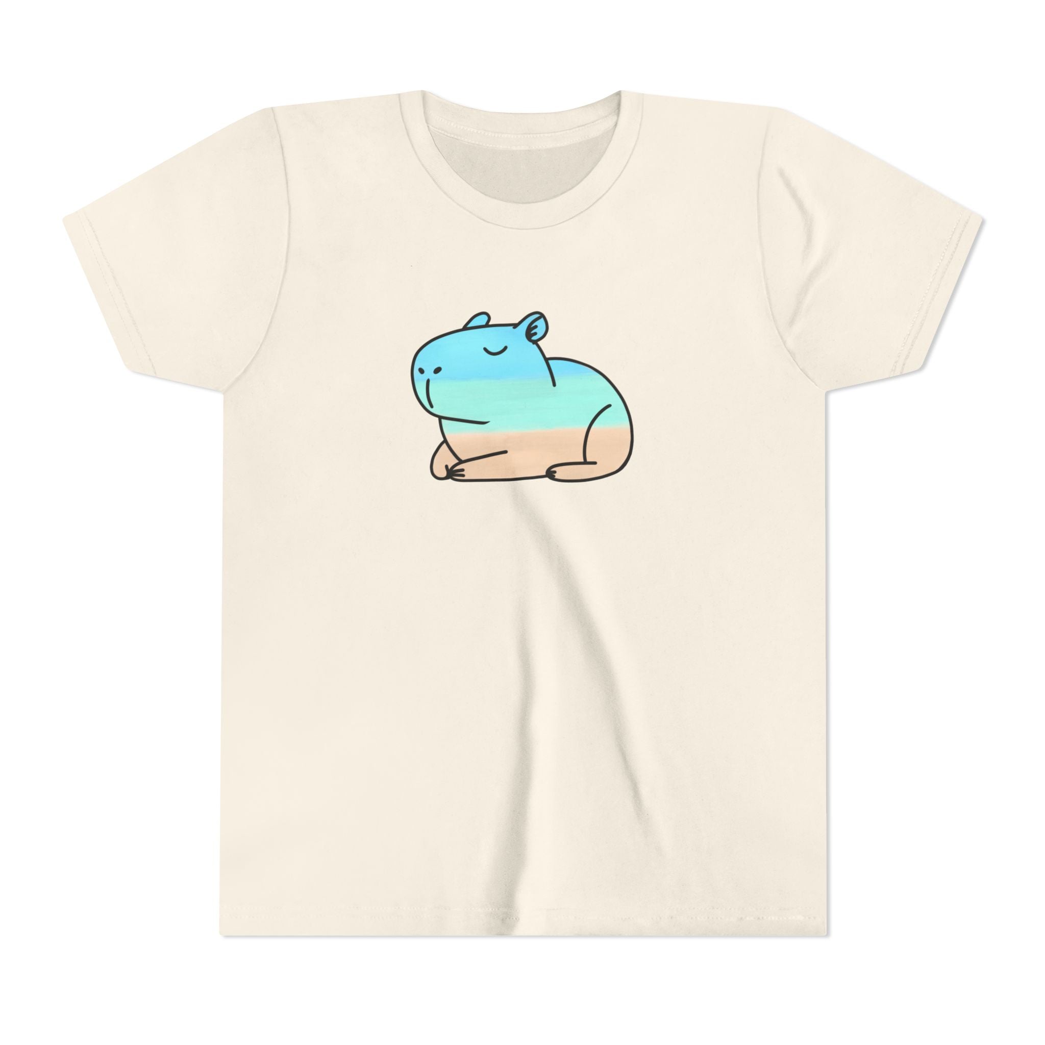 Capy Life kids t-shirt in cream cotton with a hand-painted blue and tan coastal capybara graphic on the front.