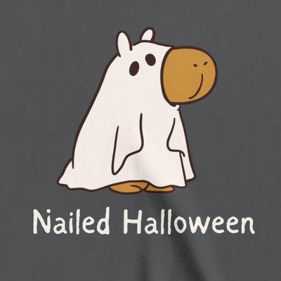 Capy Life kids dark grey t-shirt featuring a cute capybara in a ghost costume with the text Nailed Halloween.
