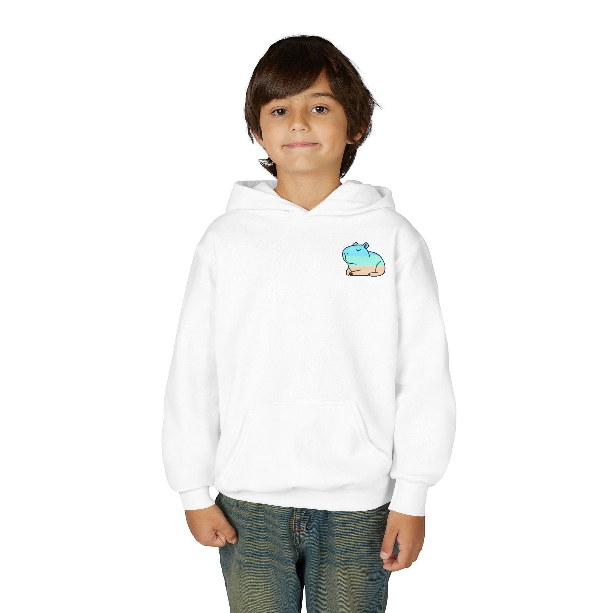 A young boy wearing a white Capy Life kids hoodie with a small blue and tan capybara graphic on the chest.