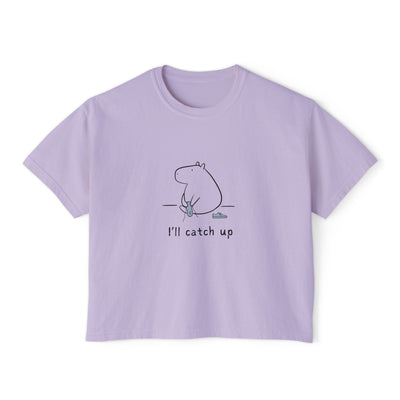 Capy Life lavender boxy cropped t-shirt featuring a minimalist line-drawn capybara graphic with I'll catch up text.