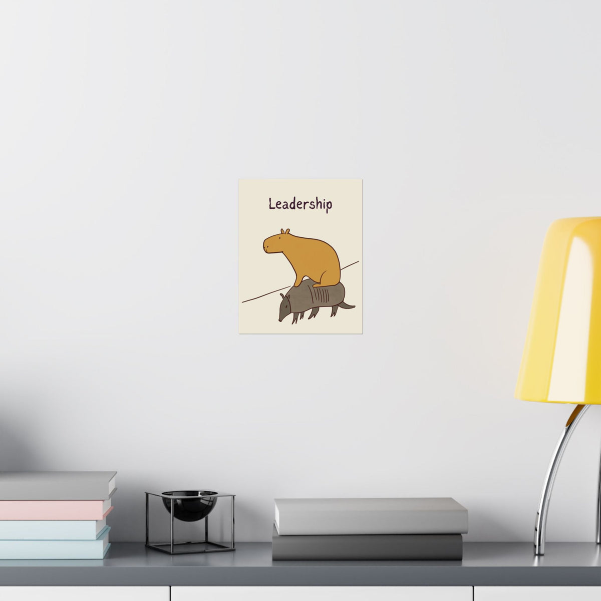 Capy Life minimalist wall art print featuring a capybara sitting on an armadillo with the text Leadership