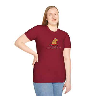 Woman wearing a maroon Capy Life softstyle t-shirt featuring a capybara in a red wagon with the text Festive against my will