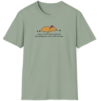Capy Life softstyle t-shirt in sage green featuring a graphic of Gene the capybara in a Santa hat with holiday text.