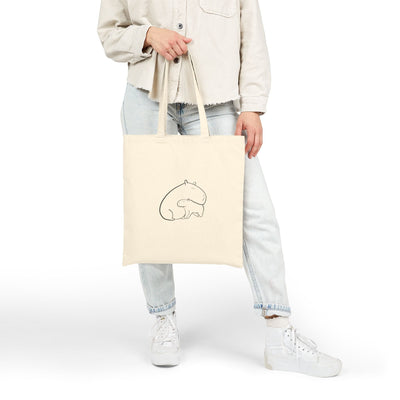 Capy Life natural cotton canvas tote bag featuring a minimalist line drawing of a mother and baby capybara snuggling.