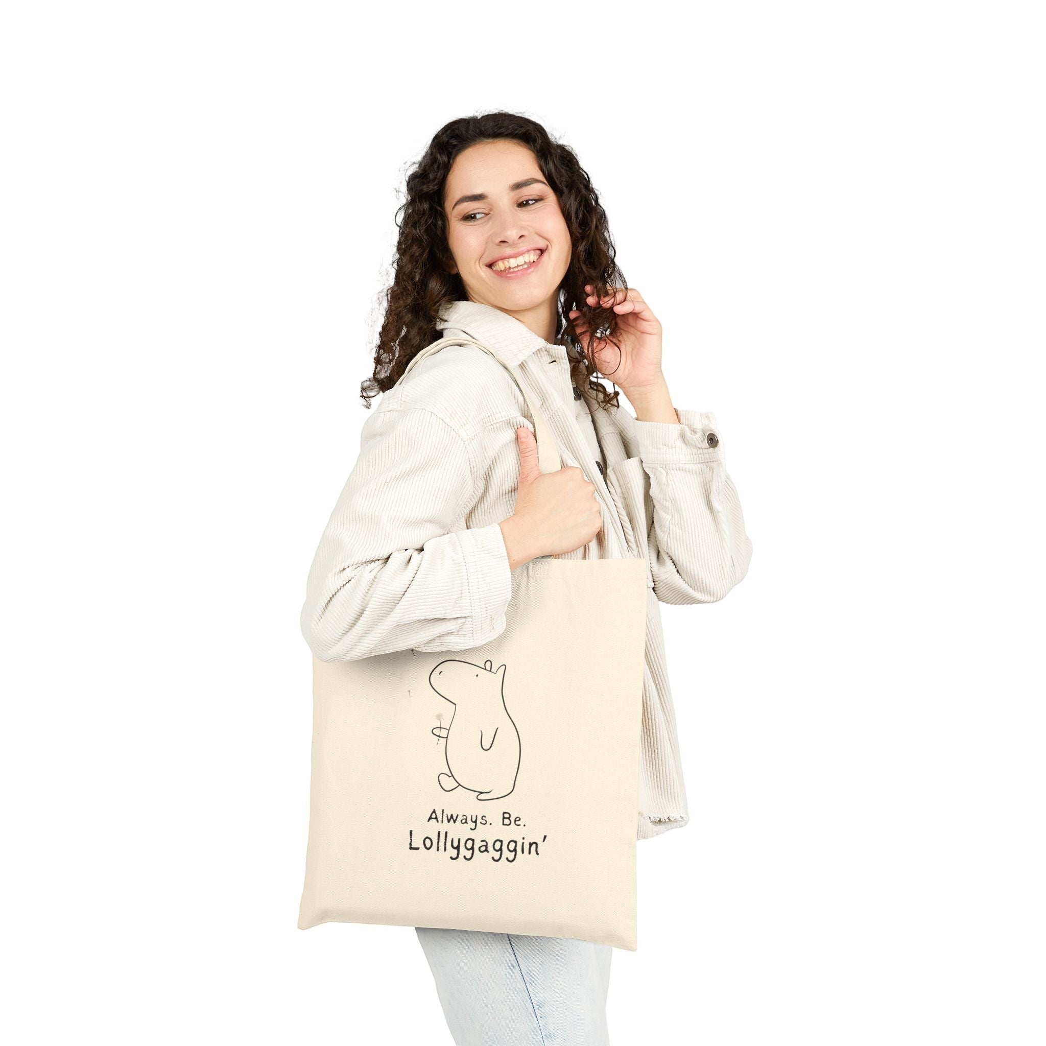 Capy Life natural canvas tote bag featuring a minimalist capybara illustration and Always Be Lollygaggin text
