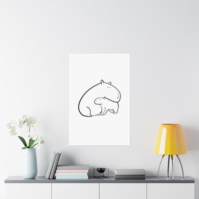 Capy Life minimalist wall art featuring a black line drawing of a parent and baby capybara in a modern nursery setting