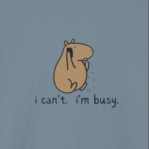 Capy Life minimalist blue t-shirt featuring a hand-drawn capybara snacking with the text i cant im busy