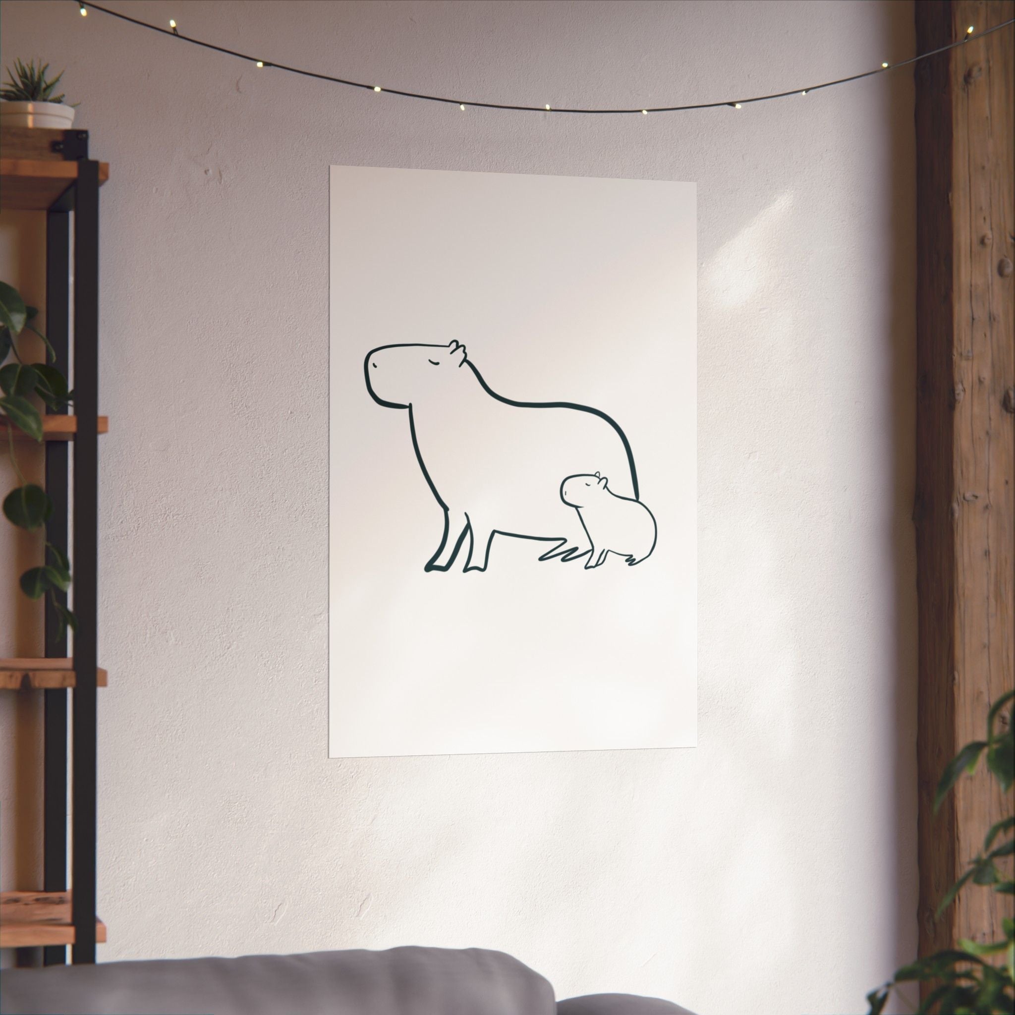 Capy Life minimalist line drawing of a mama and baby capybara on a white wall in a cozy, modern nursery setting.