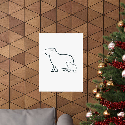 Capy Life minimalist line drawing of a mama and baby capybara on a wall with wood paneling and a Christmas tree.