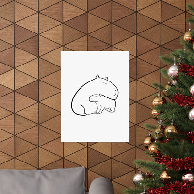 Capy Life minimalist black line art print of a mama and baby capybara hanging on a wood-paneled wall near a tree.