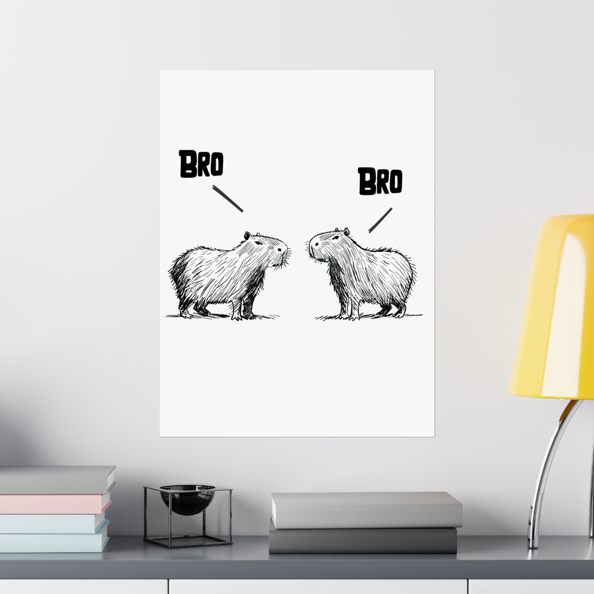 Capy Life minimalist wall art print featuring two hand-drawn capybaras facing each other with the word BRO above them.