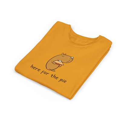 Capy Life kids t-shirt in mustard yellow featuring a cute capybara holding a pie with whipped cream on its nose.