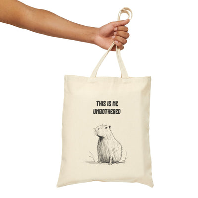 Capy Life natural canvas tote bag featuring a minimalist capybara illustration and This Is Me Unbothered text