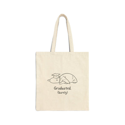 Capy Life natural cotton canvas tote bag featuring a hand-drawn capybara in a graduation cap with Graduated (barely) text