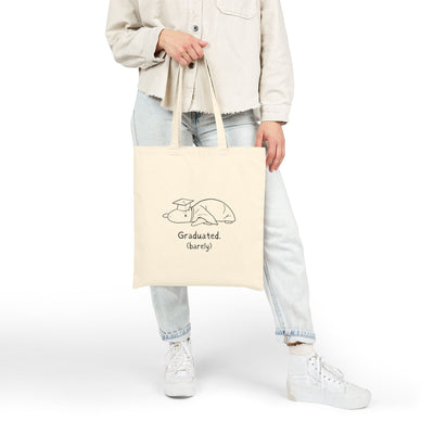 Capy Life natural cotton canvas tote bag featuring a hand-drawn capybara in a graduation cap with funny text.