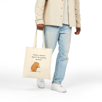 Capy Life natural cotton canvas tote bag featuring a capybara drinking coffee with the text Taking a moment