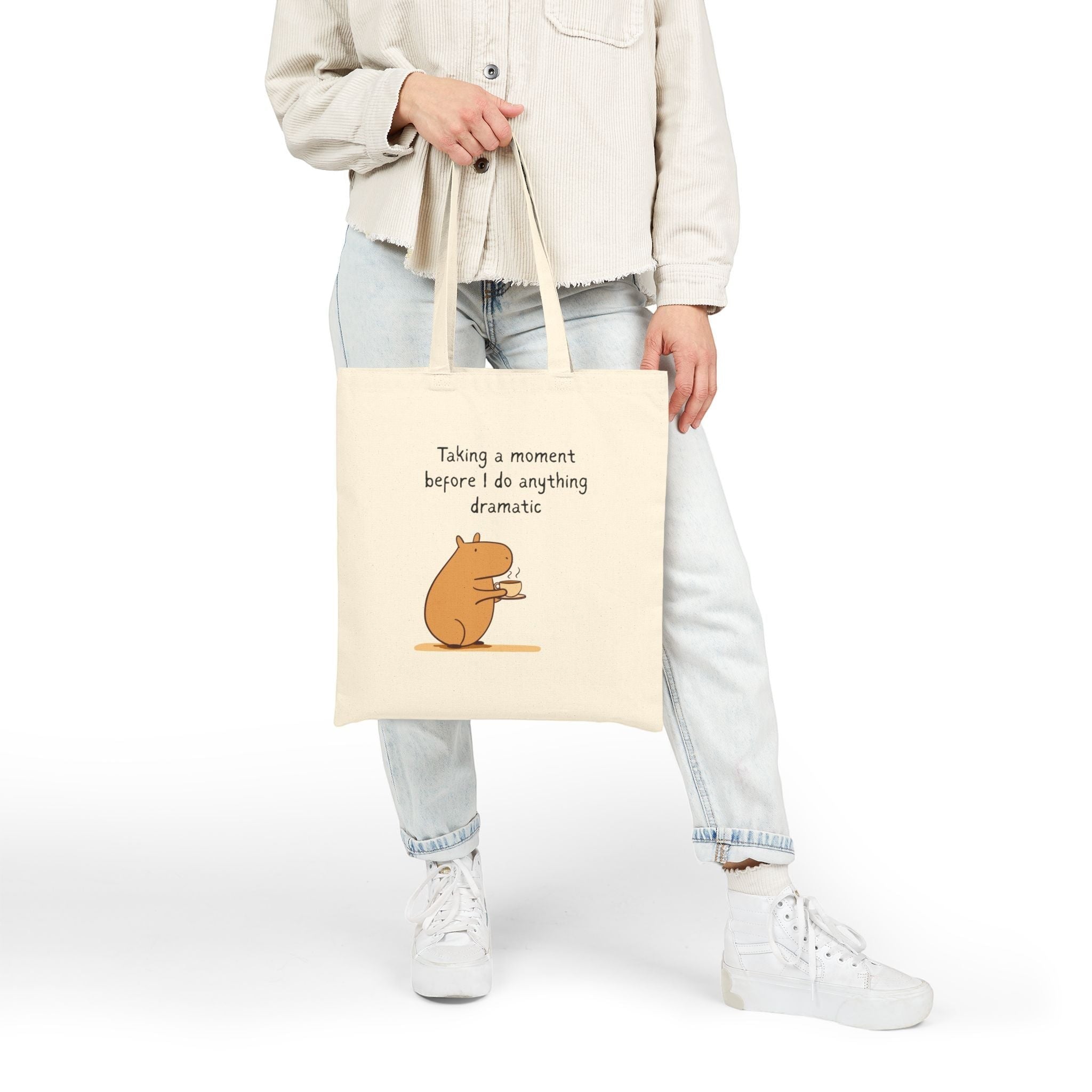 Capy Life natural cotton canvas tote bag featuring a capybara drinking coffee with the text Taking a moment before I do anything dramatic