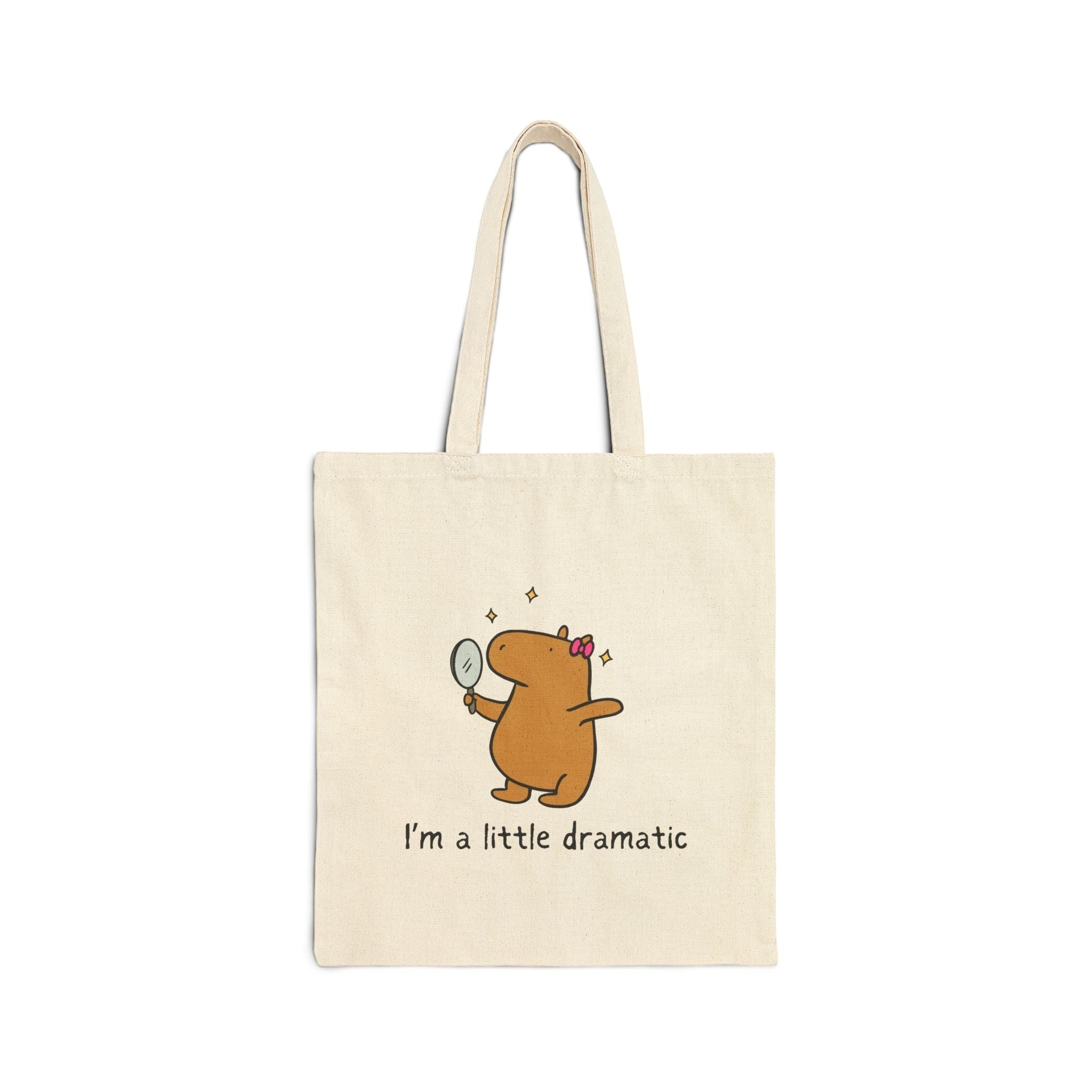 Capy Life natural cotton canvas tote bag featuring a cute capybara holding a mirror with the text I am a little dramatic