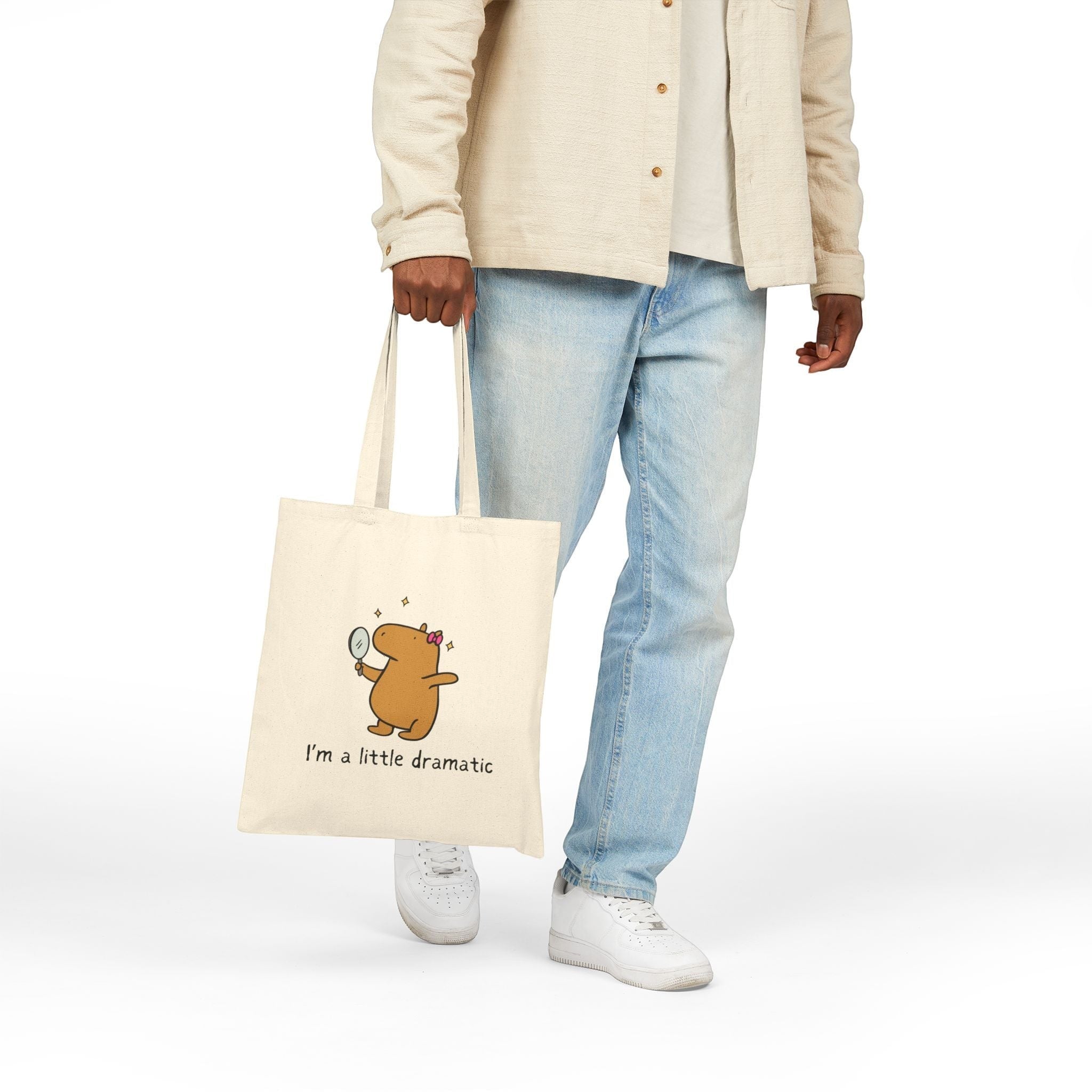 Capy Life natural cotton canvas tote bag featuring a cute capybara holding a mirror with the text I'm a little dramatic
