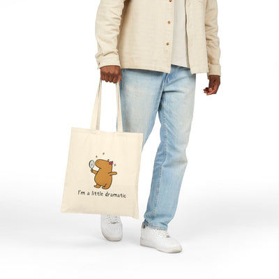 Capy Life natural cotton canvas tote bag featuring a cute capybara holding a mirror with the text I'm a little dramatic
