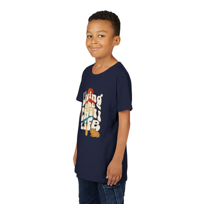 Capy Life youth navy t-shirt with a retro popsicle and capybara graphic worn by a young boy