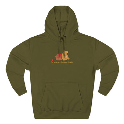 Capy Life olive green fleece hoodie featuring a cute capybara illustration with apples and a cider donut graphic.
