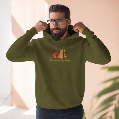 Capy Life olive green fleece hoodie featuring a cute capybara eating a donut next to an apple basket