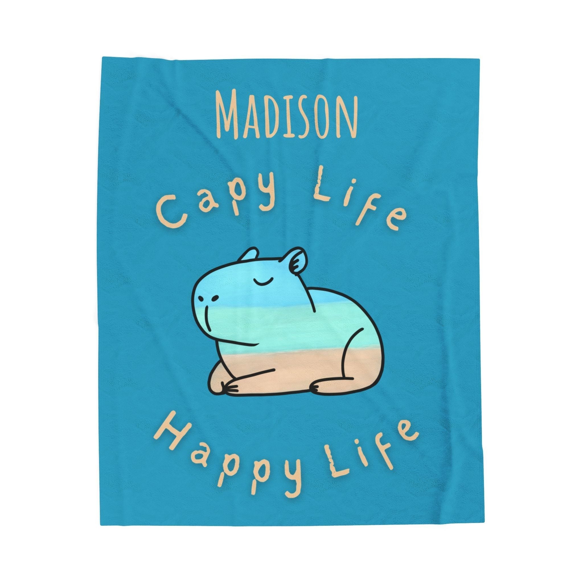 Capy Life personalized blue velveteen throw blanket featuring a hand-painted capybara design and custom name.
