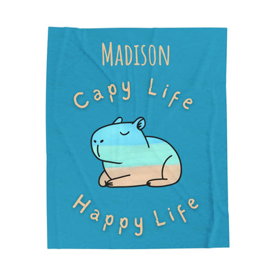 Capy Life personalized blue velveteen throw blanket featuring a hand-painted capybara design and custom name.