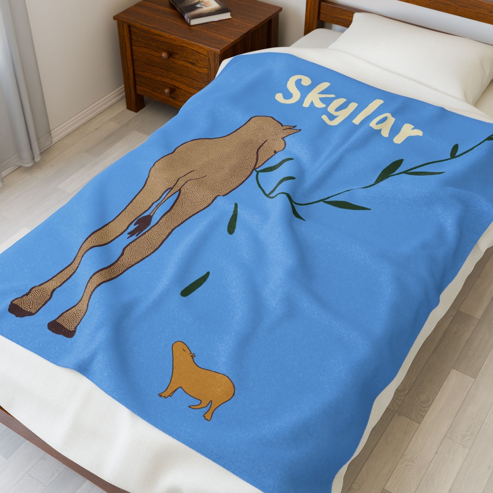 Capy Life personalized blue fleece baby blanket featuring a giraffe and capybara illustration with the name Skylar.