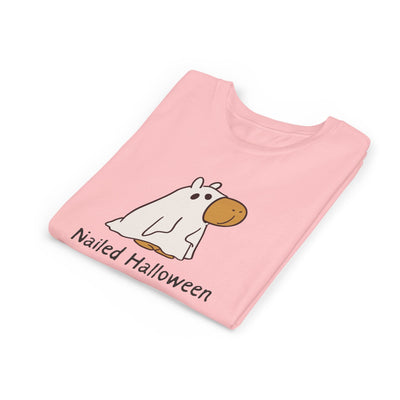 Capy Life kids pink t-shirt featuring a cartoon capybara in a ghost costume with the text Nailed Halloween