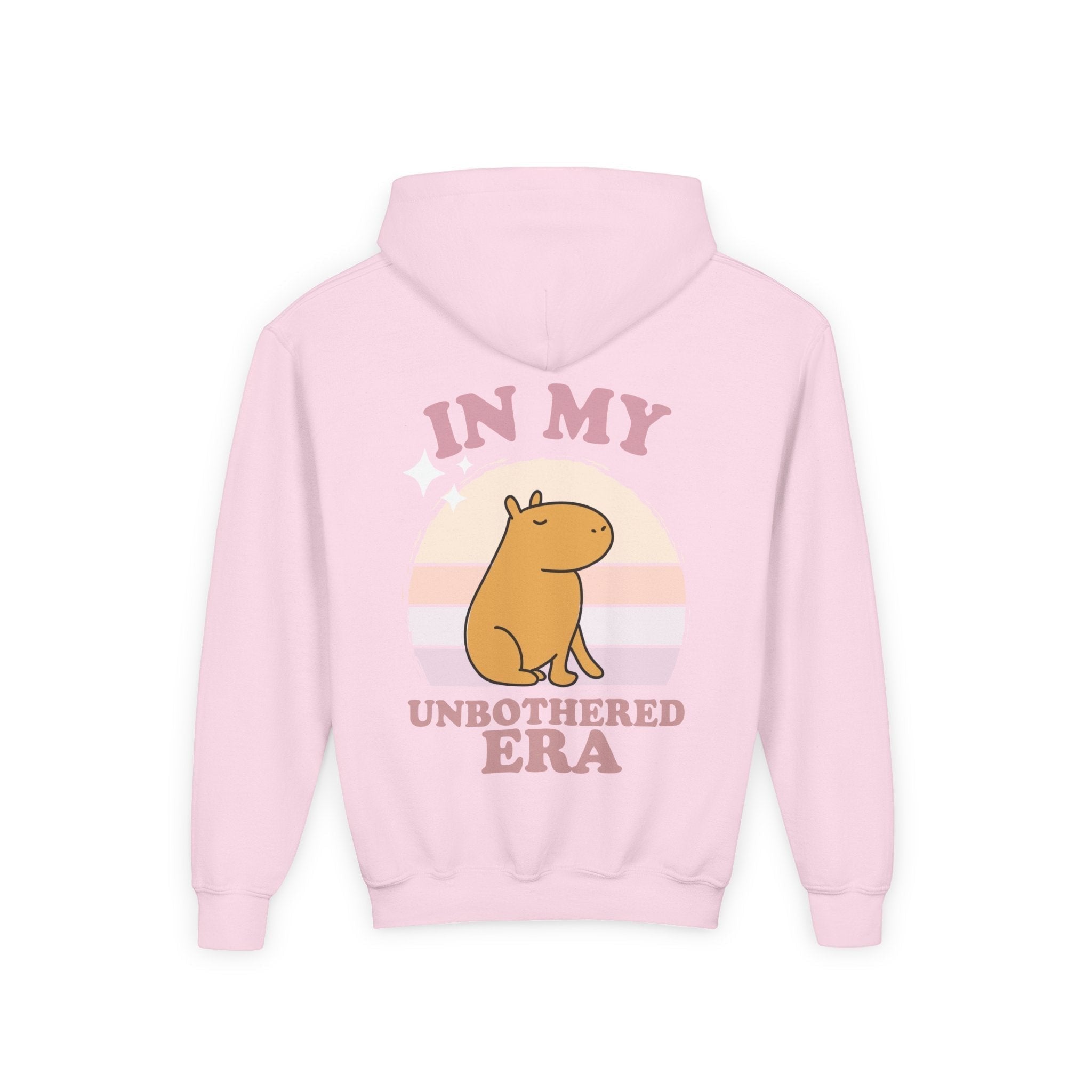Capy Life pink hoodie featuring a retro sunset graphic with a capybara and the text In My Unbothered Era on the back