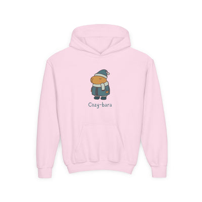Capy Life light pink kids hoodie featuring a cute Cozy-bara graphic of a capybara in a winter puffer coat and scarf.