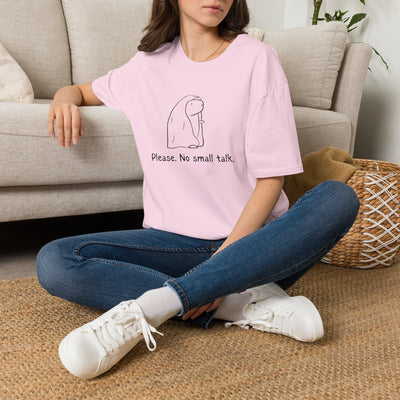 Capy Life light pink softstyle t-shirt with a capybara graphic and the text Please. No small talk. worn by a woman.