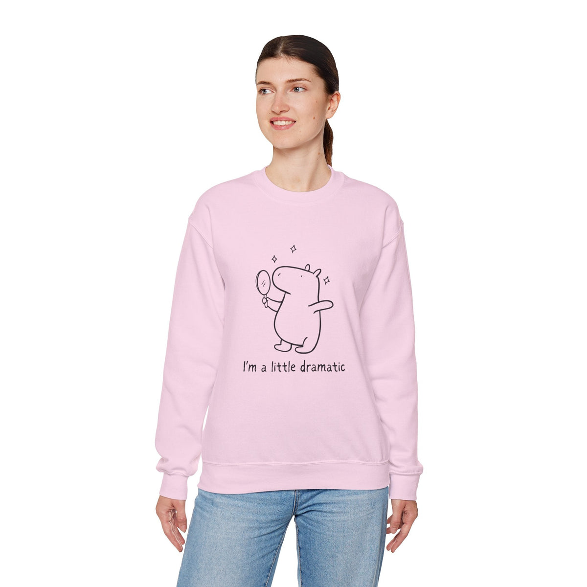 Capy Life light pink crewneck sweatshirt featuring a line-drawn capybara holding a mirror with the text I am a little dramatic