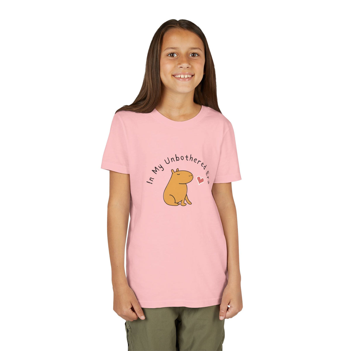 Capy Life youth t-shirt in soft pink featuring a cute capybara illustration and In My Unbothered Era text