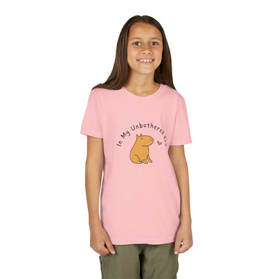 Capy Life youth t-shirt in soft pink featuring a cute capybara illustration and In My Unbothered Era text
