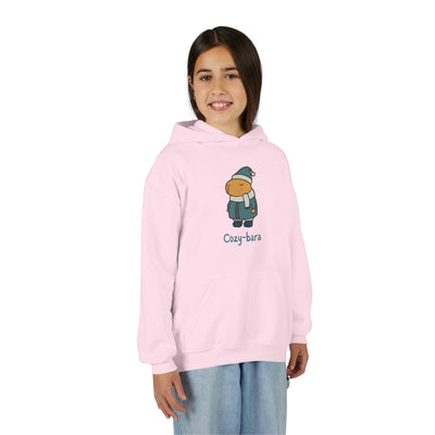 Capy Life light pink kids hoodie featuring a cute Cozy-bara capybara graphic with a puffer coat and winter hat