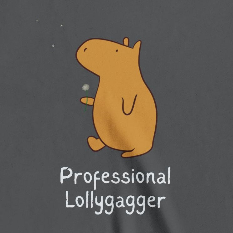Capy Life kids t-shirt in charcoal grey featuring a hand-drawn orange capybara and Professional Lollygagger text