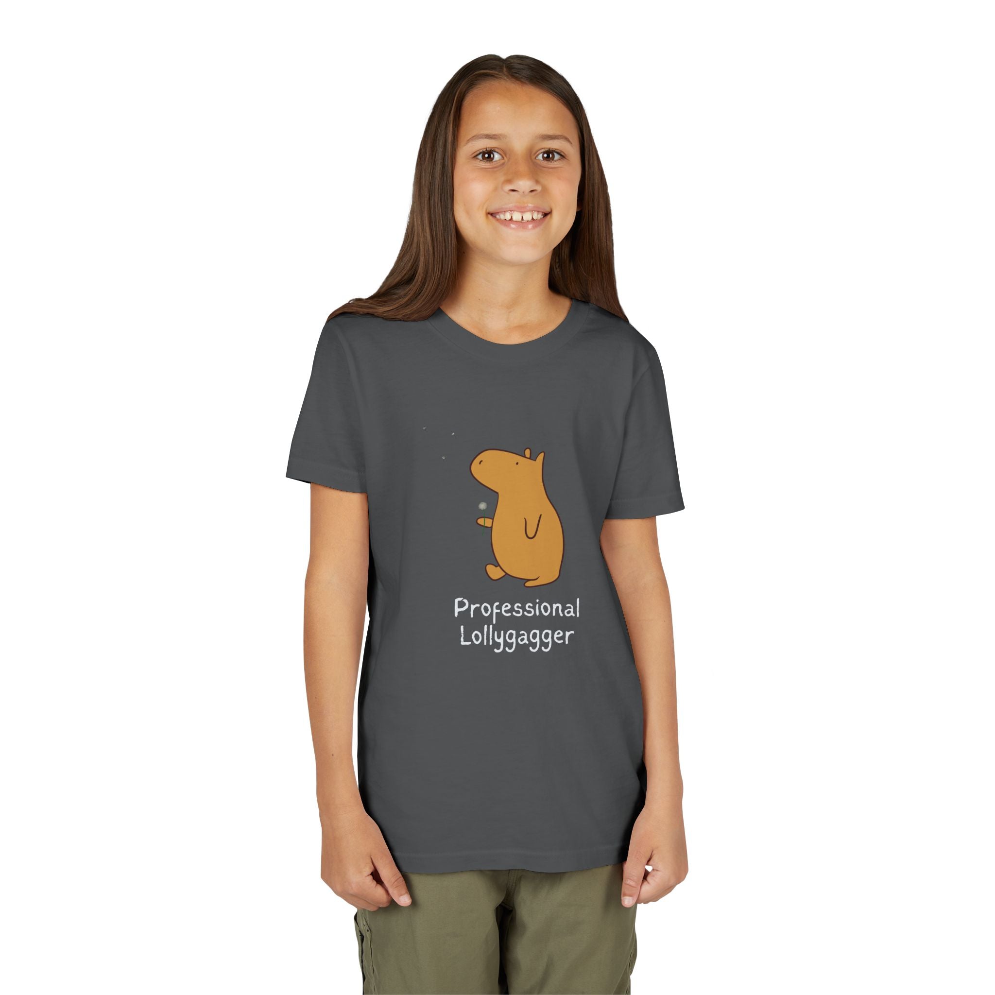 A smiling girl wearing a dark grey Capy Life cotton t-shirt featuring a cute capybara and Professional Lollygagger text