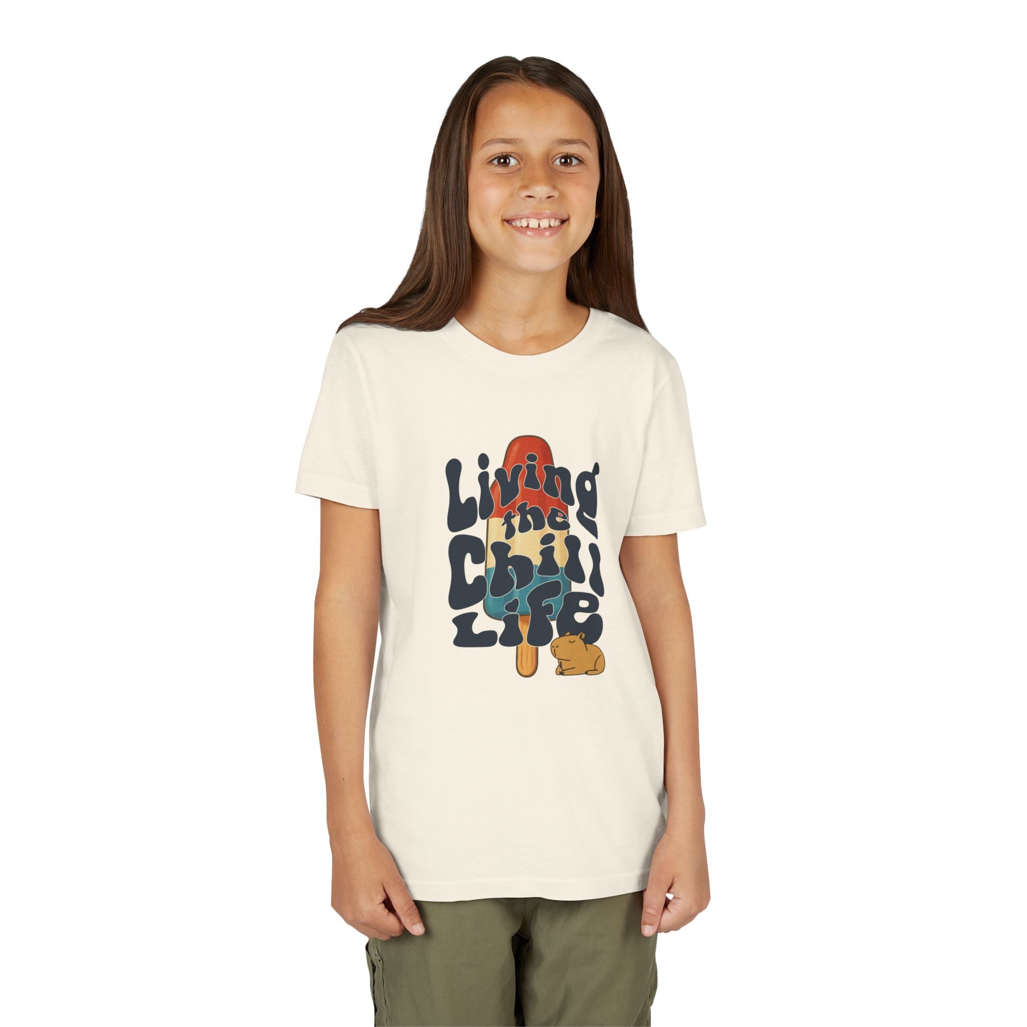 Capy Life youth tee featuring a retro popsicle graphic, groovy text, and a cute capybara on a cream cotton shirt.