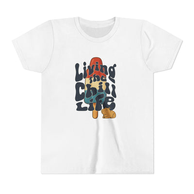 Capy Life youth white cotton t-shirt featuring a retro popsicle graphic with a capybara and Living the Chill Life text.