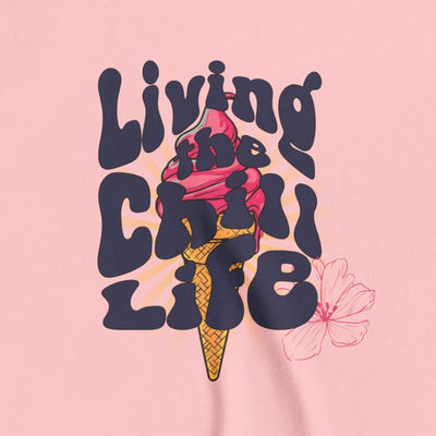 Capy Life youth tee featuring a retro Living the Chill Life graphic with an ice cream cone and flower on pink cotton