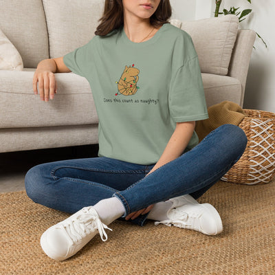 Capy Life softstyle sage green t-shirt featuring a hand-drawn capybara tangled in Christmas lights on a woman