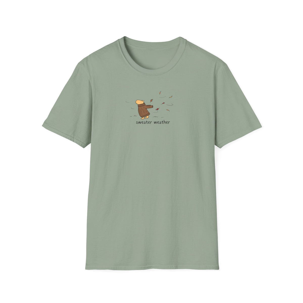 Capy Life softstyle t-shirt in sage green featuring a small graphic of a capybara in a brown sweater in autumn wind.