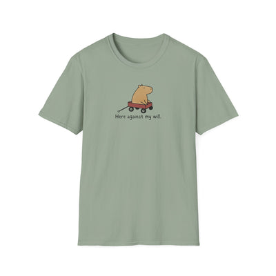 Capy Life sage green softstyle t-shirt featuring a minimalist capybara in a red wagon with Here against my will text.