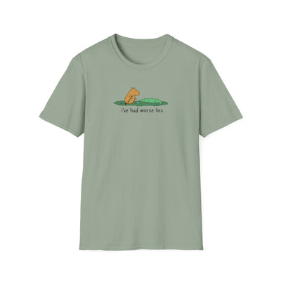 Capy Life sage green softstyle t-shirt featuring a hand-drawn illustration of a capybara and alligator with text.