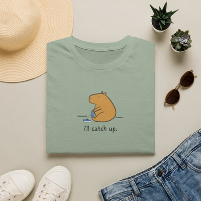 Capy Life softstyle t-shirt in sage green featuring a minimalist illustration of a capybara sitting with the text i'll catch up.