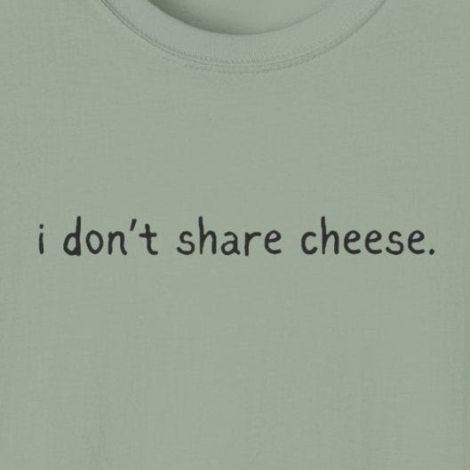 Capy Life sage green softstyle t-shirt featuring the minimalist handwritten text i don’t share cheese on the chest.