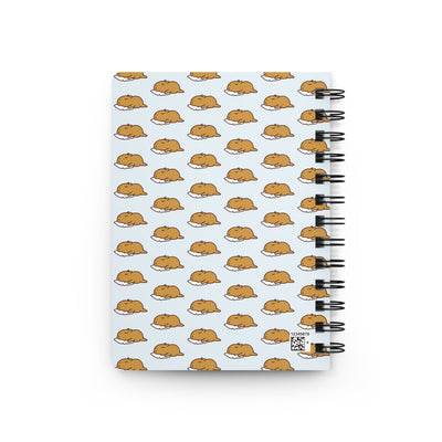 Capy Life spiral notebook featuring a repeating pattern of cute sleeping capybaras on a soft blue background.